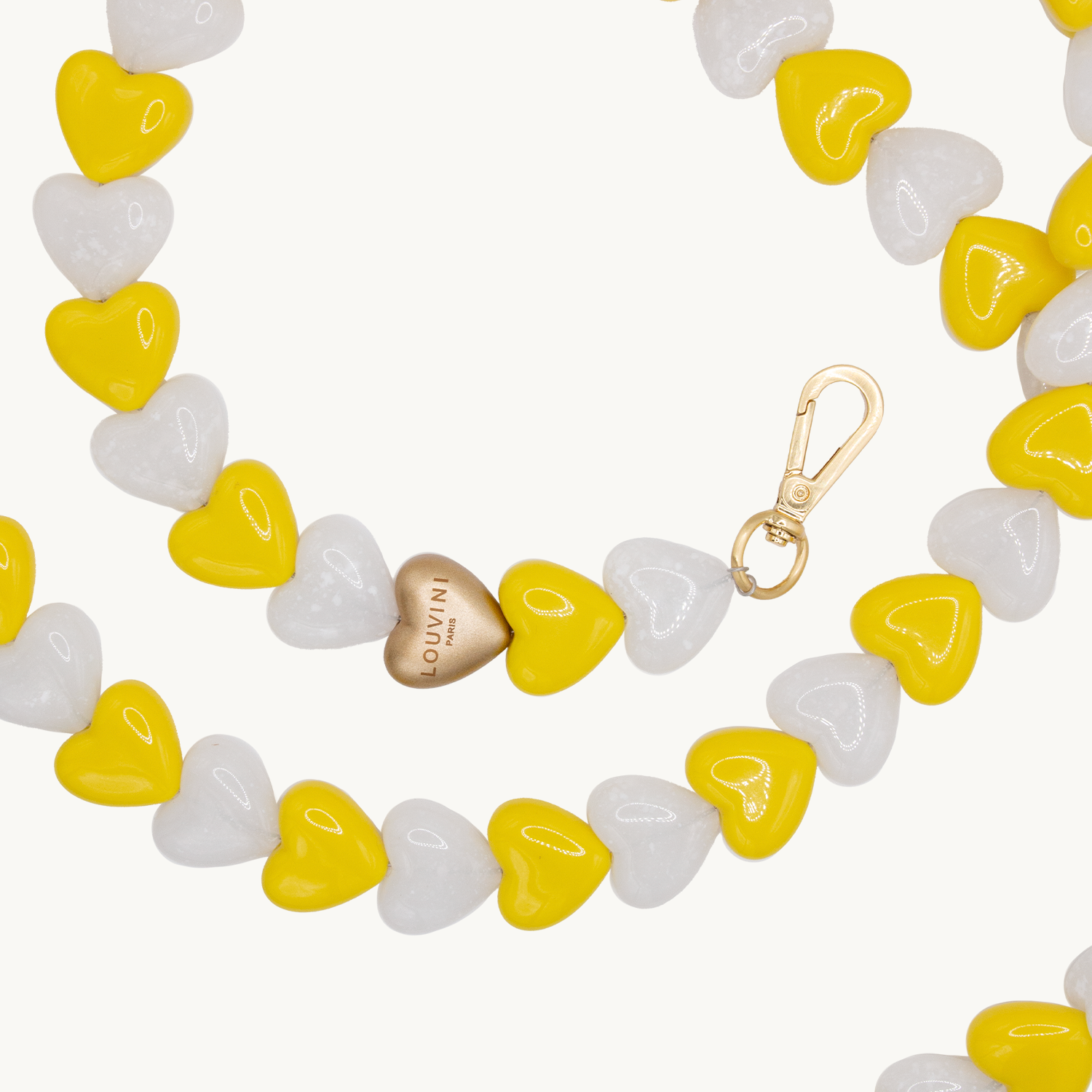 Chaîne pour téléphone coeur blanc jaune