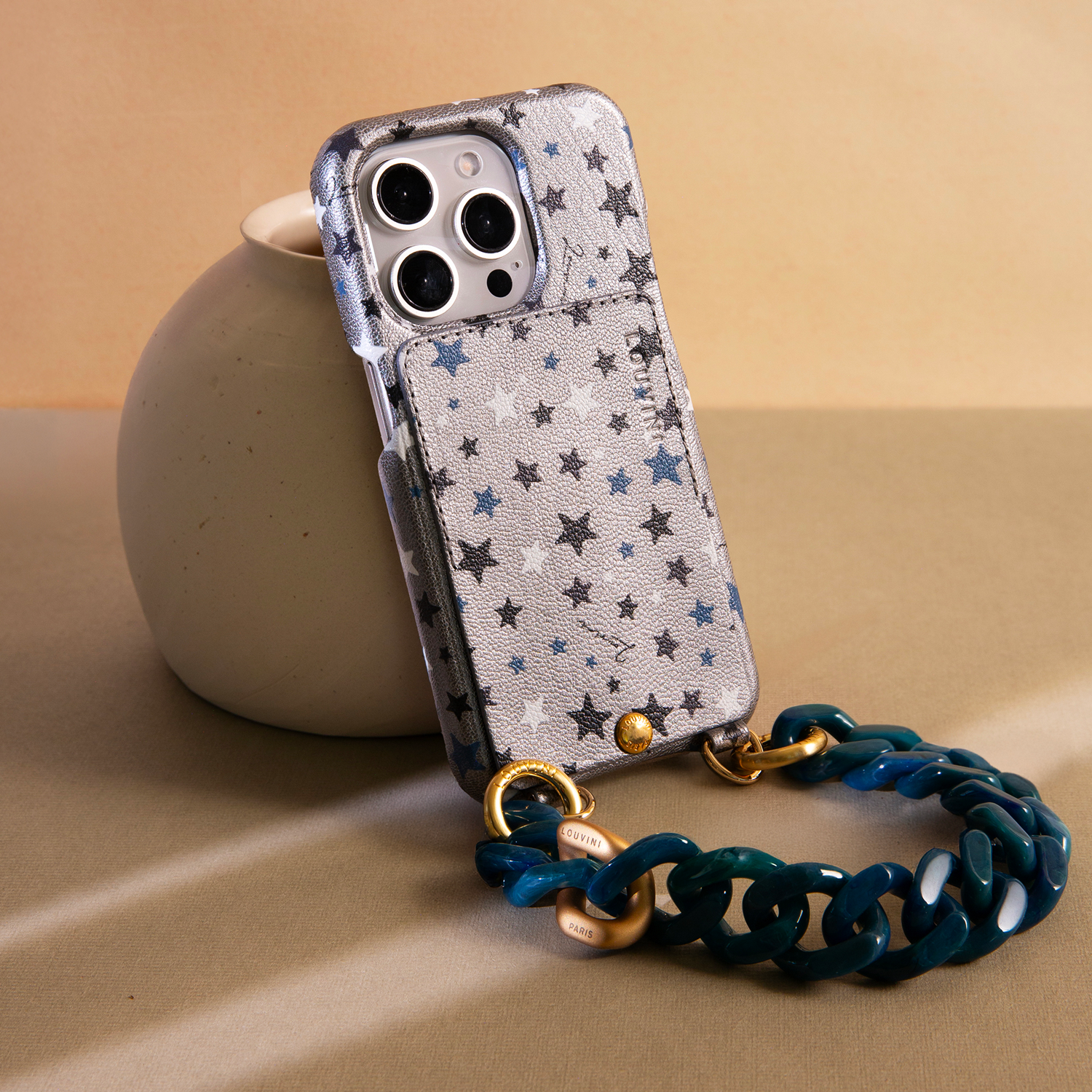 coque en cuir argenté imprimé étoiles et bracelet de téléphone bleu vert