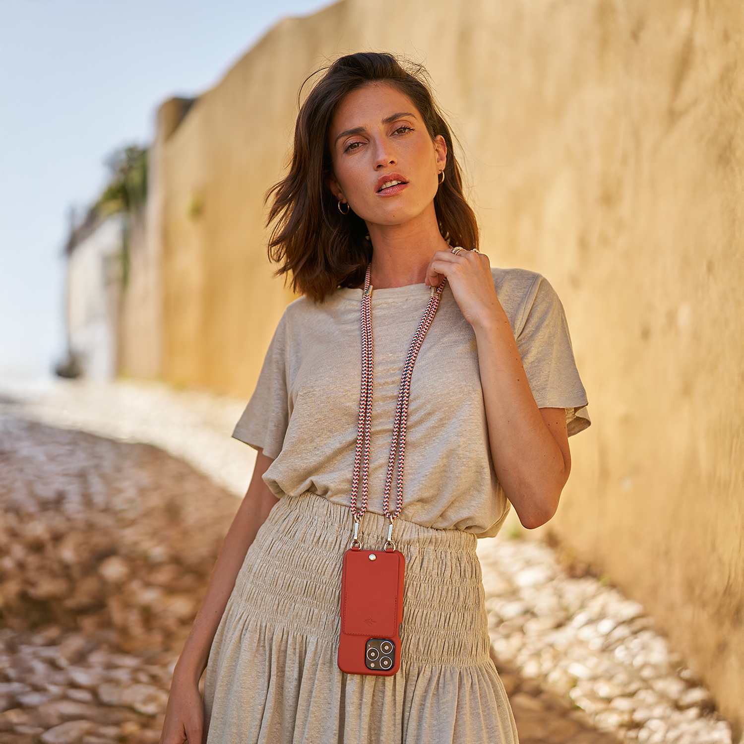 Leather iPhone case with wallet and loops LOU x AIRELLES - ORANGE