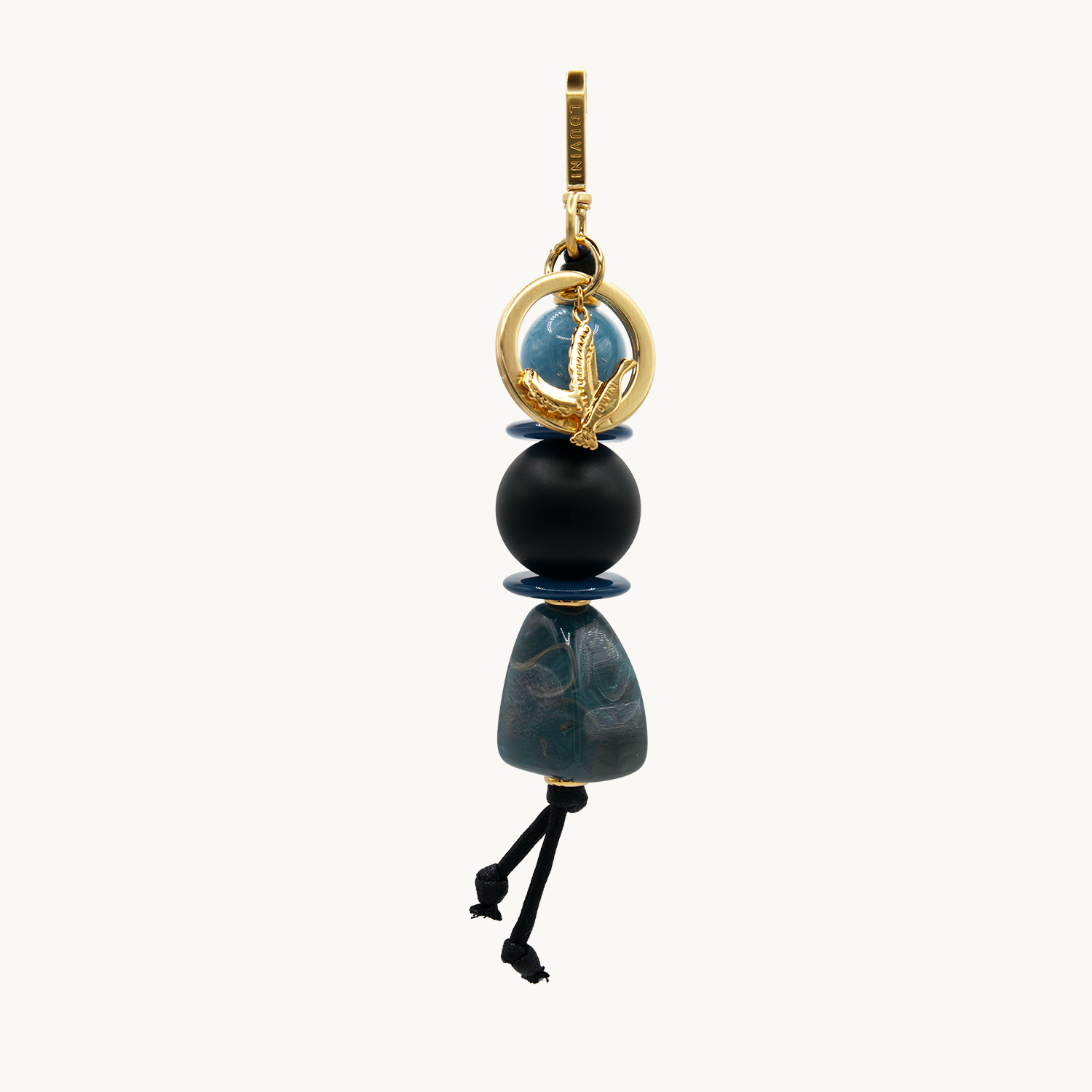 Porte-clés doré avec mousqueton, anneau et perles décoratives effet marbre bleu et noir