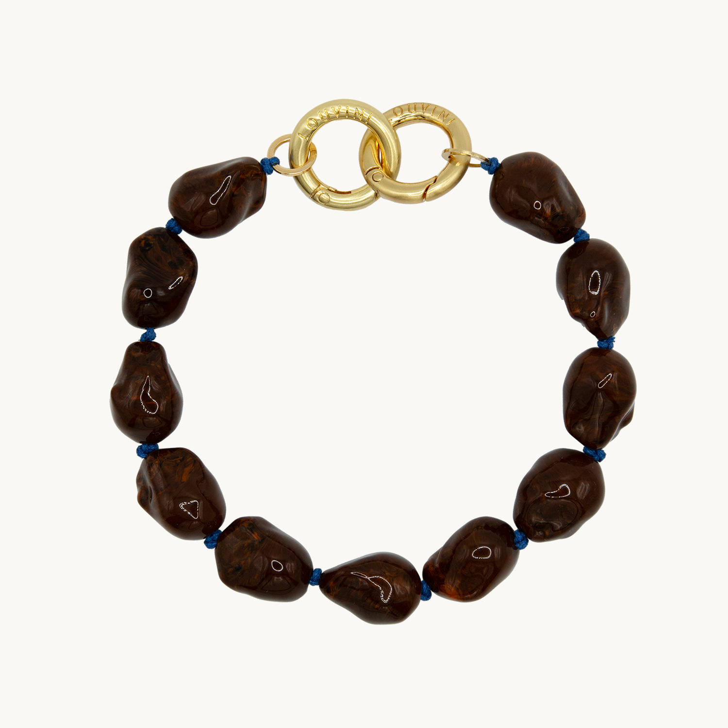 Bracelet pour téléphone avec pierres en résine et anneaux dorés